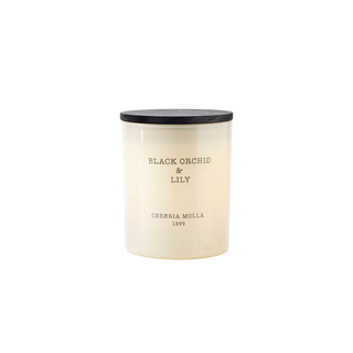 Candle with black lid and white body on a white background