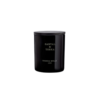 Black candle container with 'Santal & Tonka' text on a white background