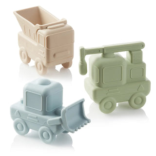 Three toy construction vehicles in beige, green, and blue on a white background