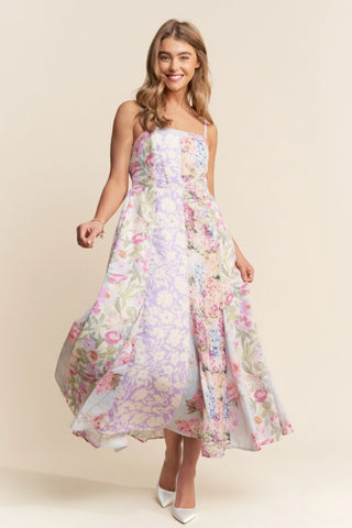 Woman wearing a floral dress on a beige background