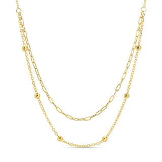 Two gold necklaces on a white background