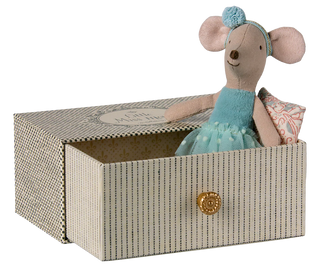 Stuffed mouse toy in a decorative box with a blue dress and pom-pom hat.