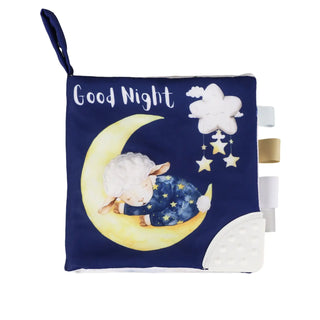 Children's soft book with a sheep on a moon and stars design, labeled 'Good Night'.