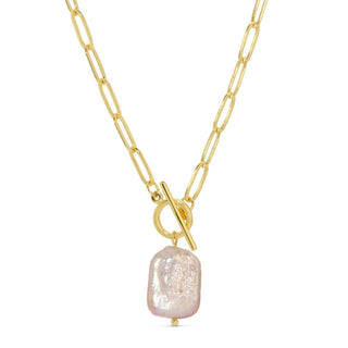 Gold necklace with a large pearl pendant on a white background