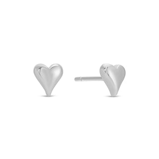 Heart-shaped silver stud earrings on a white background