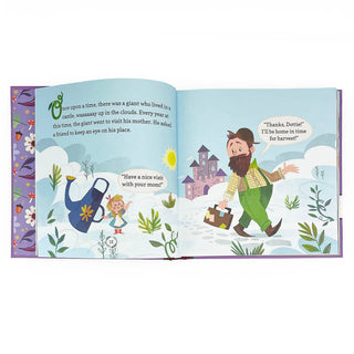 Illustrated book open to a page with a fairy tale scene, featuring a giant and a castle.