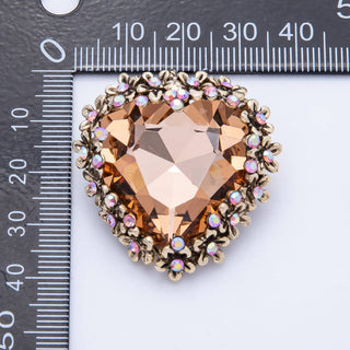 Jewelry with a large central gemstone and smaller stones on a ruler background