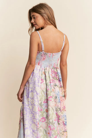 Woman wearing a floral dress against a beige background