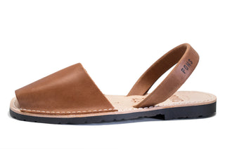 Brown sandal with a slingback design on a white background