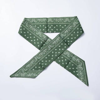 Green bandana with white patterns on a white background