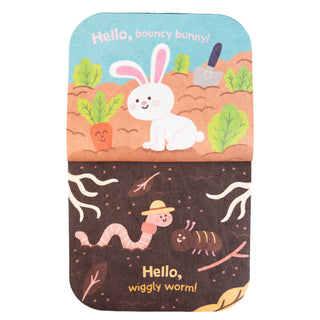 Children's book with illustrations of a bunny and worm on a white background