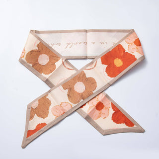Floral patterned dog bandana on a light gray background