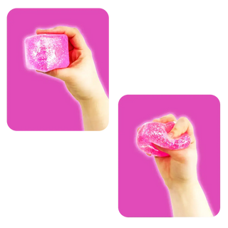 Two hands holding pink glittery objects against a pink background