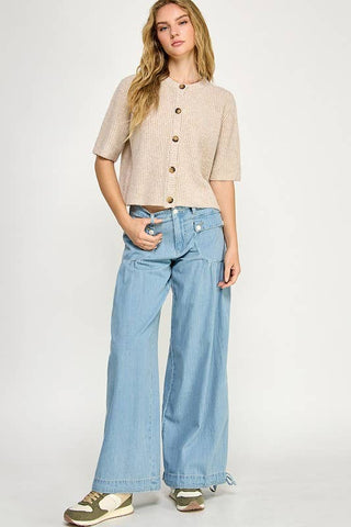 Beige button up the front sweater. 1/2 sleeve.