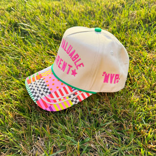Colorful cap with text on grass