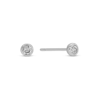 Pair of silver stud earrings with clear gemstones on a white background