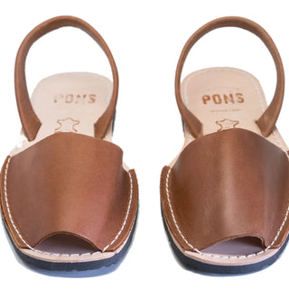 Pair of brown sandals with 'PONS' branding on a white background