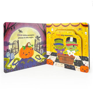 Open children's book with Halloween-themed illustrations of a pumpkin and monsters.