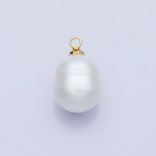Pearl pendant with gold clasp on a light gray background