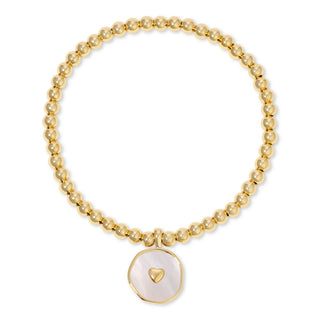 Gold beaded bracelet with a heart charm on a white background