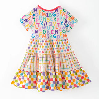 Colorful dress with alphabet pattern on a white background
