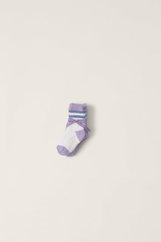 Purple and white sock on a light beige background