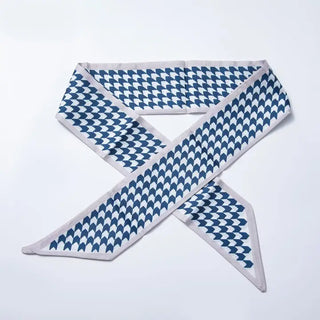 Blue and white patterned bandana on a light gray background