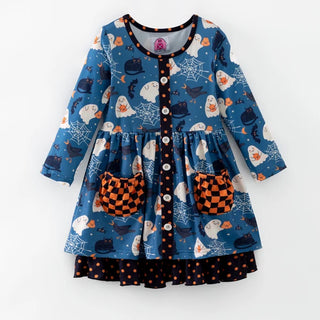 A toddler's long-sleeve dress with a blue Halloween print featuring ghosts, bats, spiders, and orange pumpkins, with orange and black checkered pockets and a polka-dot ruffled hem.