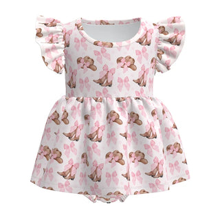 Children's dress with teddy bear and bow pattern on a white background