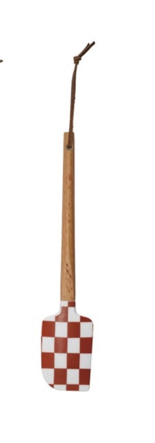 Spatula with checkered pattern on a white background