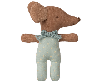 Stuffed toy mouse with a knitted bow tie and light blue outfit on a white background