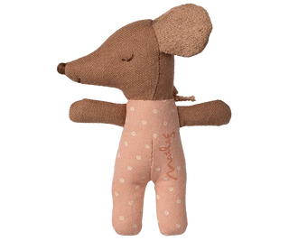 Brown plush toy with a pink outfit on a white background