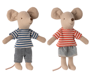 Two toy mice dressed in striped shirts and shorts on a white background