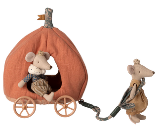 Toy mouse pulling a pumpkin-shaped carriage with another mouse inside on a white background