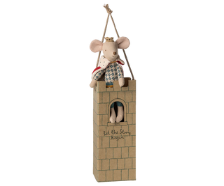 Stuffed mouse in a small tower with a white background