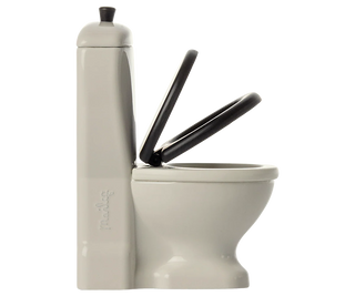 White toilet with a black seat cover on a white background