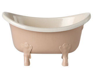 Beige freestanding bathtub with white interior on a white background