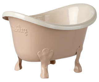 Beige bathtub with paw-like feet on a white background