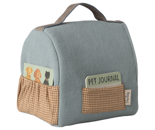 Blue pet travel bag with checkered pockets on a white background
