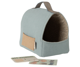 Pet bed with a small window and a pet journal on a white background