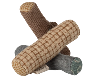 Knitted toy with checkered pattern on a white background