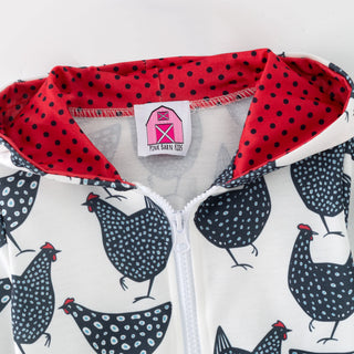 Children's jacket with red hood and chicken pattern on a white background