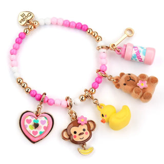A pink and white beaded charm bracelet with gold-tone metal beads and multiple cute charms, including a monkey, duck, teddy bear, heart, and a small bottle charm. The brand name 'Cherry 11' is visible on the clasp and bottle charm.