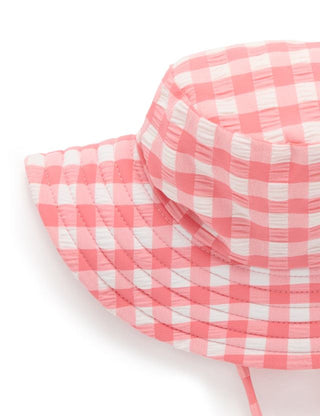 Close-up of a pink and white checkered fabric on a white background