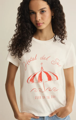 Person wearing a white t-shirt with red graphic design and text.