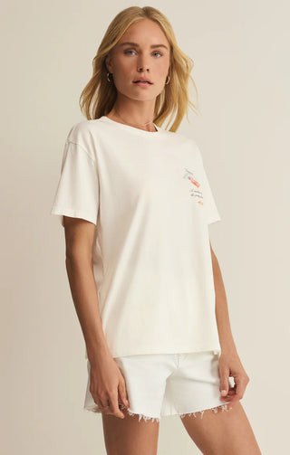 Woman wearing a white t-shirt and shorts on a beige background