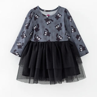 A toddler girl's long-sleeve dress featuring a gray top printed with black bats and white spiderwebs, and a layered black tulle tutu skirt, shown against a plain white background.