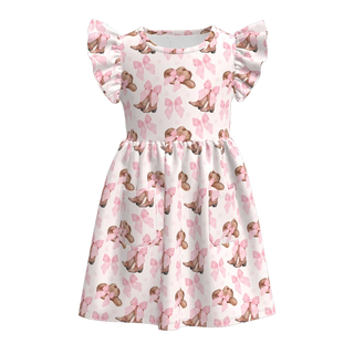 A girls' short-sleeve dress with ruffled cap sleeves, featuring an all-over print of brown dogs wearing pink bows on a white background.