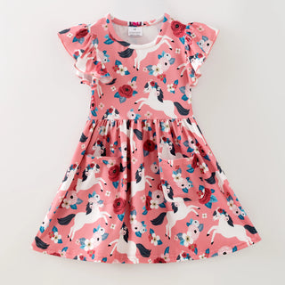 Pink dress with unicorn and floral pattern on a white background