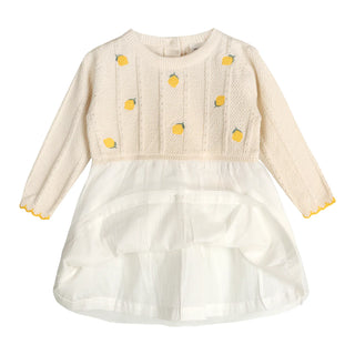Children's dress with lemon pattern on a white background
